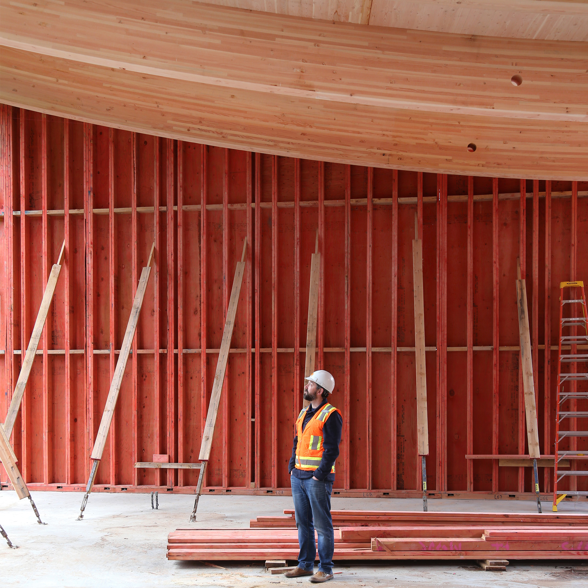 Holmes Director of Mass Timber Eric McDonnell onsite at UC Santa Cruz Kresge Renewal with curved mass timber beams.